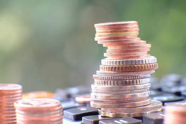 Stacks of gold money coin on table background and concept saving money, business growth strategy of money concept, advertising coins of finance and banking