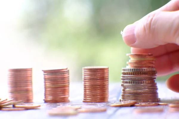 Stacks of gold money coin on table background and concept saving money, business growth strategy of money concept, advertising coins of finance and banking