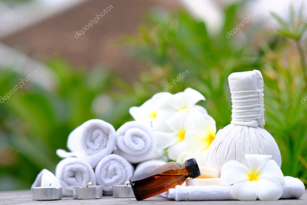 Spa Concept - Spa treatments on wooden table and spa candle light atmosphere in wellness centre