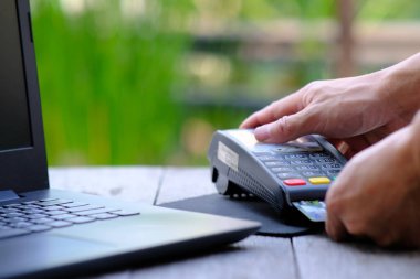 businessman hand with a credit card for online shopping