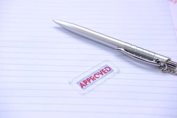 stamp with approved word on white paper background