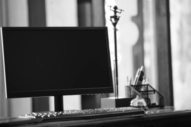 black and white photo of a laptop computer with a blank screen