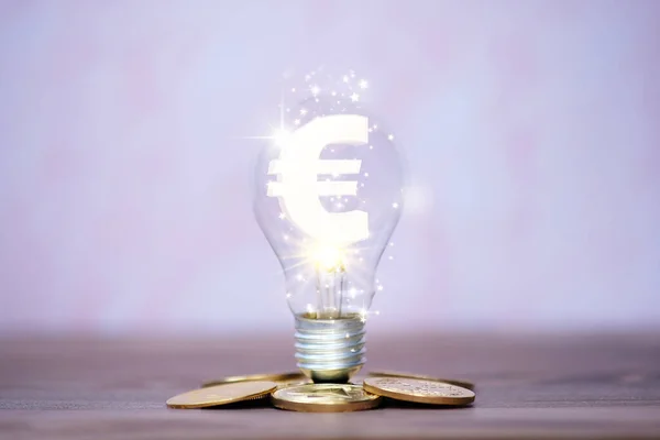 Energy saving light bulb with money and  business growth concept, new ideas innovation,saving money, finance and investment concept