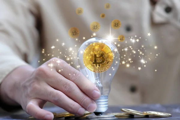 Bitcoin btc cryptocurrency coins in light bulb and digital currency money concept