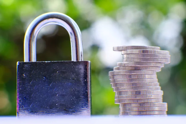 Padlock on green bokeh background and business security concept, protecting data personal information
