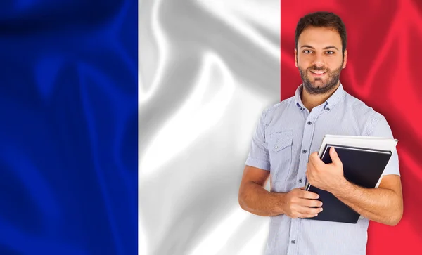 Estudante masculino sobre bandeira francesa — Fotografia de Stock