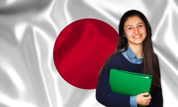 Tiener student lachend over Japanse vlag — Stockfoto