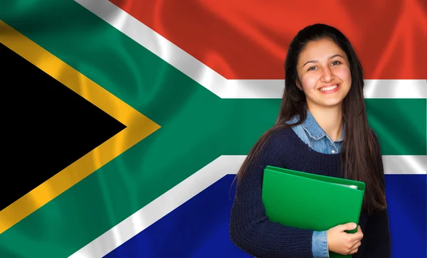 Adolescente estudiante sonriendo sobre bandera sudafricana —  Fotos de Stock