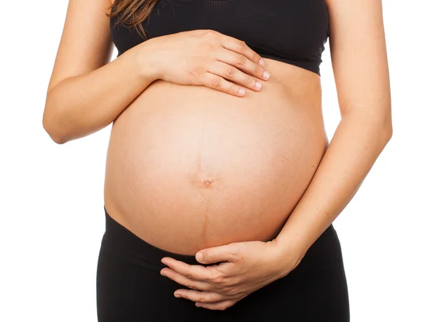 Buik van een zwangere vrouw. — Stockfoto