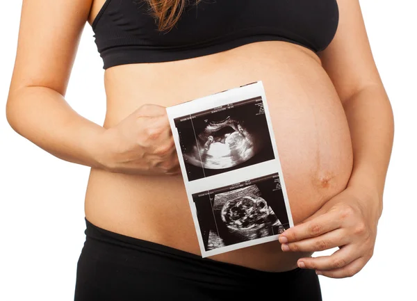 Barriga de uma mulher grávida com ultra-som do bebê — Fotografia de Stock