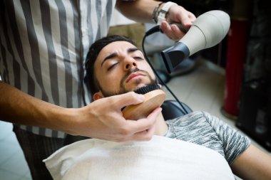 Traditional ritual of shaving the beard clipart
