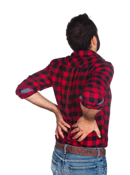 Lumberjack em camisa xadrez com dor nas costas — Fotografia de Stock