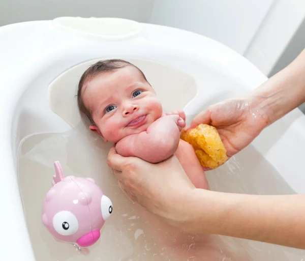 Newborn first bath — Stock Photo, Image