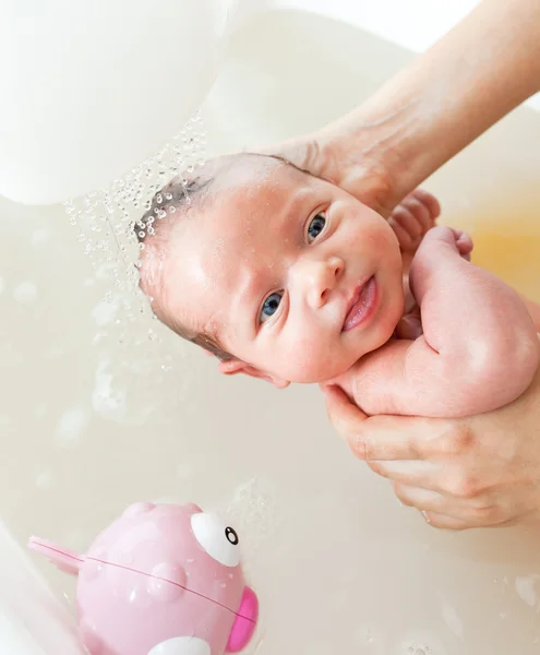 Newborn first bath — Stock Photo, Image