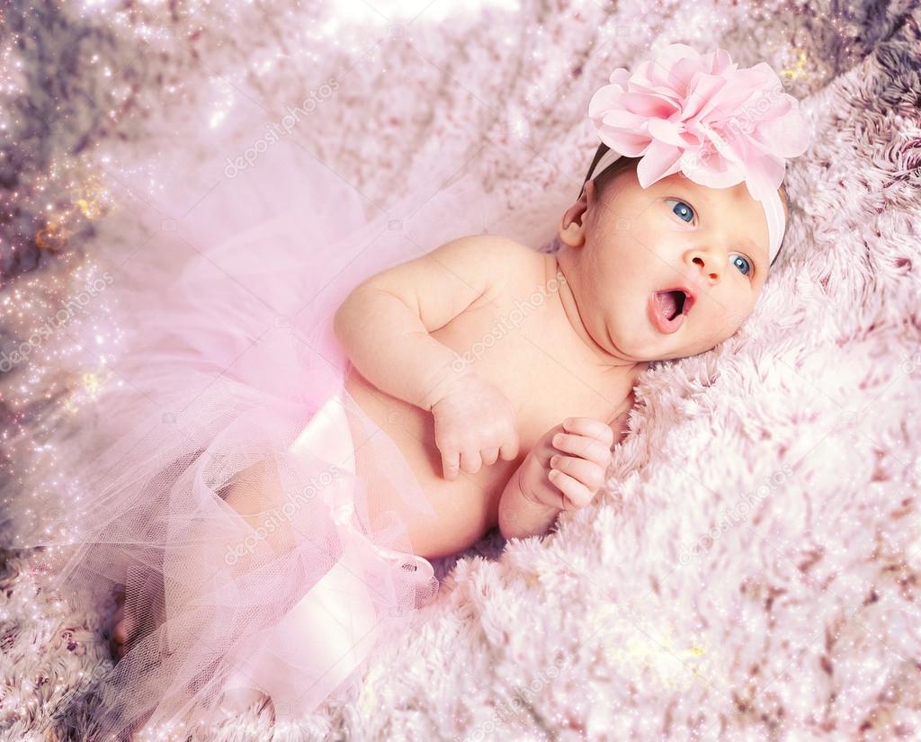 baby girl with pink tutu. Stock Photo by