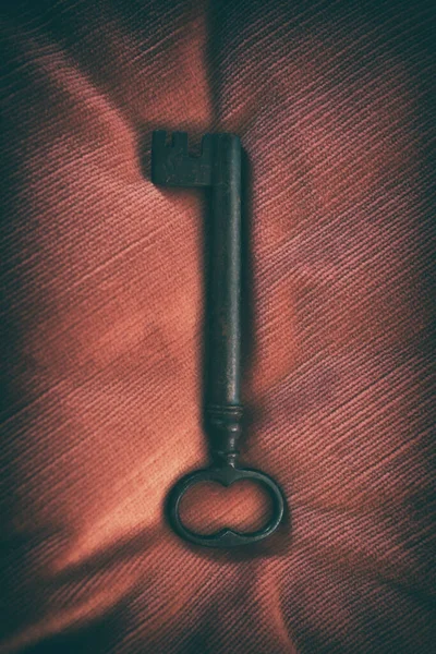 Ancient Medieval Wrought Iron Key Red Background — Stock Photo, Image