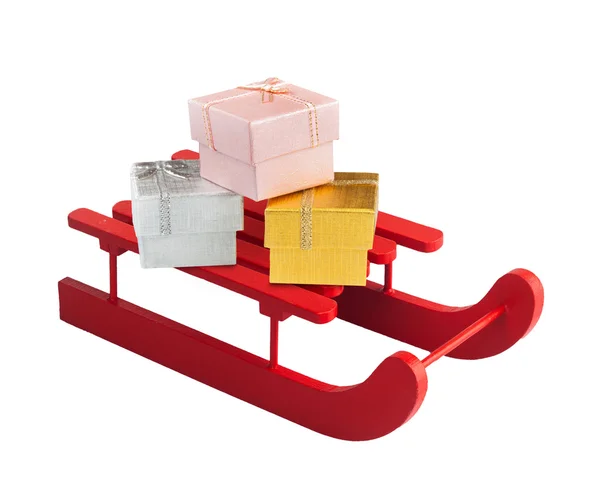 Wooden red sled with gift boxes — Stock Photo, Image