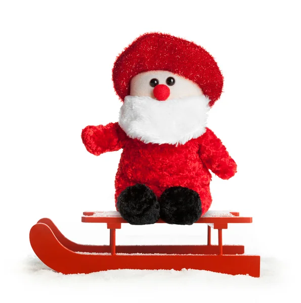 Sled vermelho de madeira com pelúcia Papai Noel — Fotografia de Stock