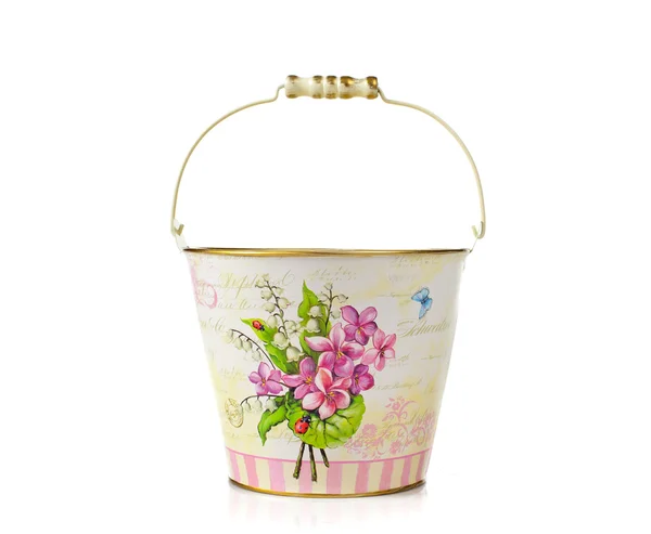 Empty bucket with vintage floral decorations — Stock Photo, Image