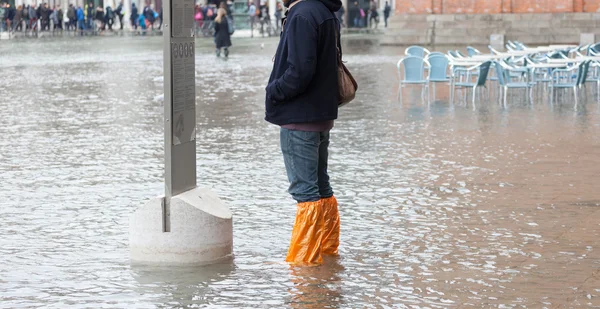 Close Up of legs with boots because to the high water in Venice . — Stok Foto