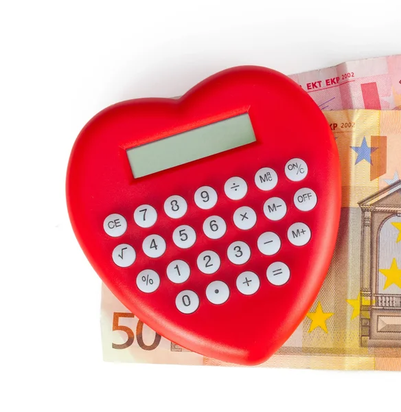 Rode hartvormige calculator met eurobankbiljetten. — Stockfoto