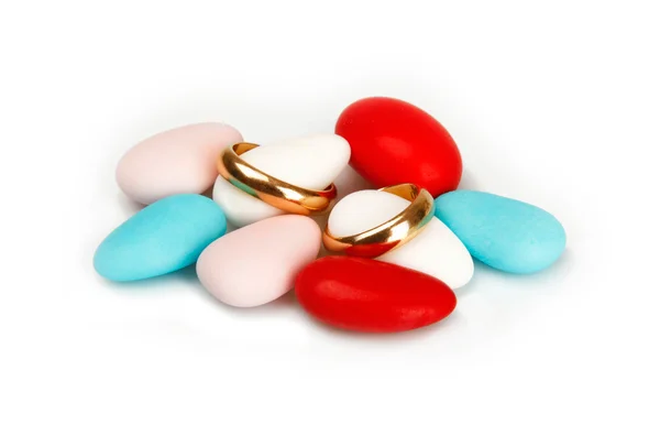 Colorful Confetti with wedding rings — Stock Photo, Image
