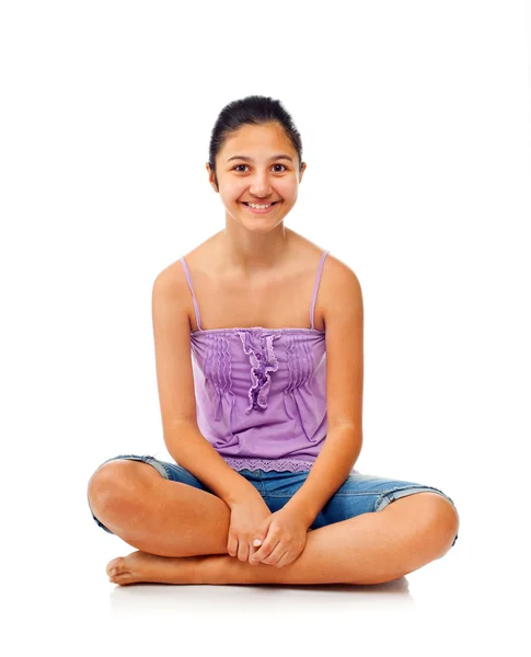 Sitting teenage girl while rejoices with arms up. — Stock Photo, Image