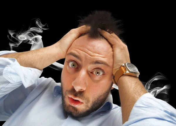 Stressed man with smoke coming out of his ears — Stock Photo, Image