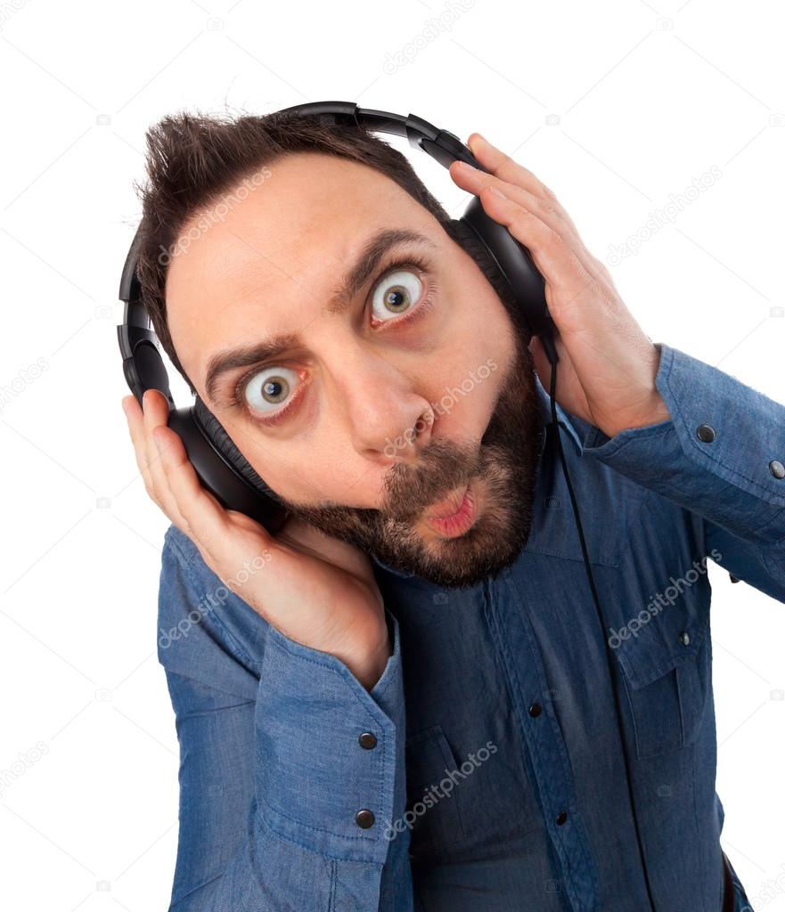 Young surprised man with headphones