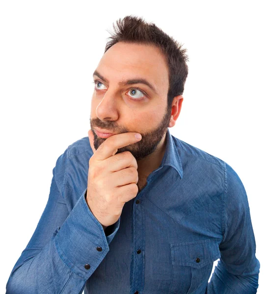 Funny young man looks for an idea — Stock Photo, Image