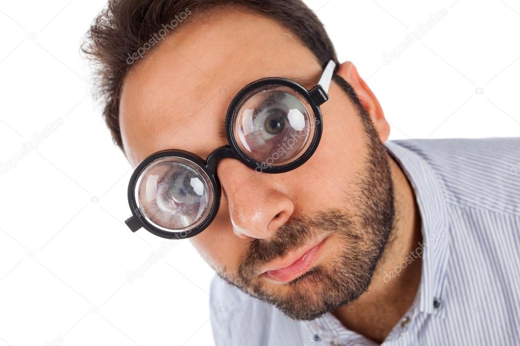 Man with a surprised expression and thick glasses