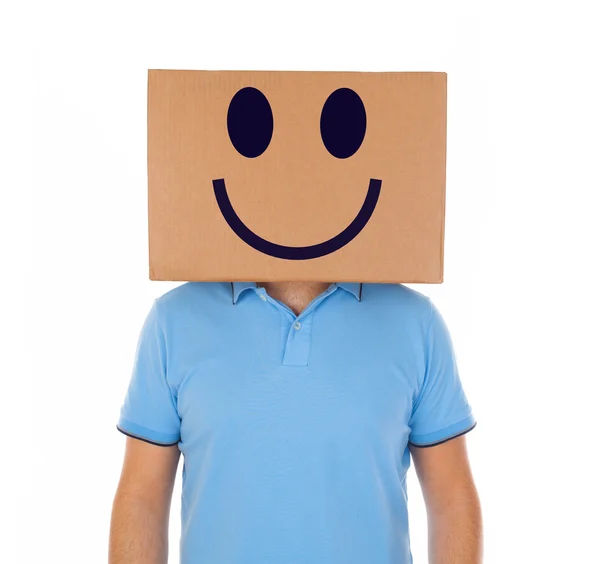 Man står med en kartong på hans huvud med smiley ansikte — Stockfoto