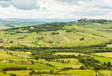 View of the town of Pienza with the typical Tuscan hills clipart
