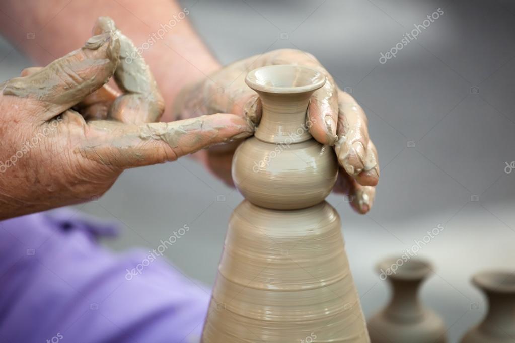 Hands making pottery on a wheel Stock Photo by ©AntonioGravante 83162044