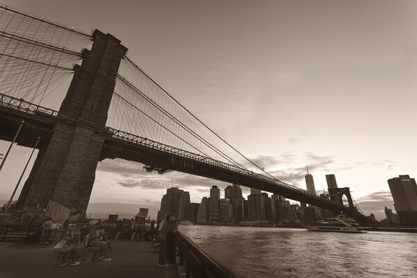 Brooklyn Bridge and lower Manhattan in sepia tone