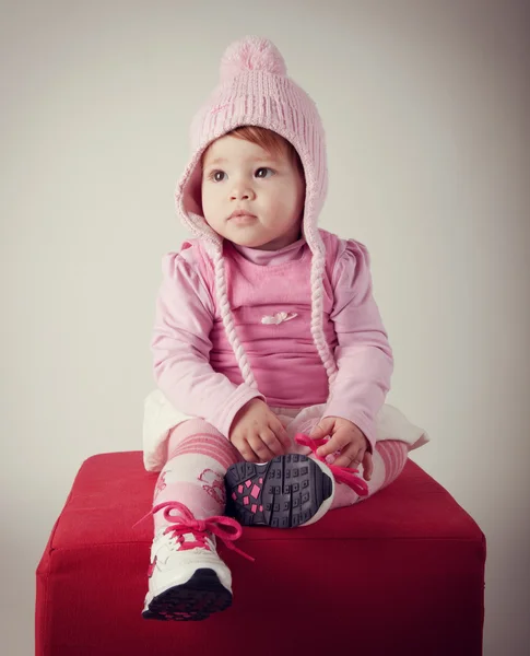 Portratit of baby with pink woolen hat — Stock Photo, Image