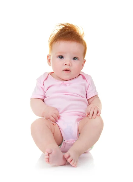 Bebê em macacão rosa no fundo branco — Fotografia de Stock