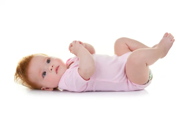 Bebê menina deitada no branco — Fotografia de Stock