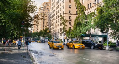 Yellow cabs in Manhattan in a rainy day.
