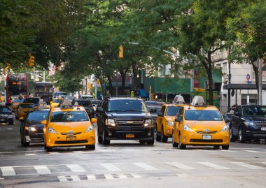 Yellow cabs in Manhattan in a rainy day.