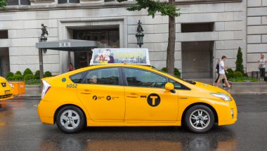 Yellow cabs in Manhattan in a rainy day.