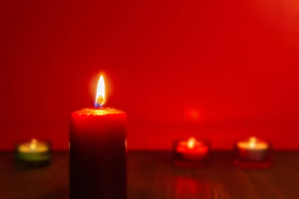 Red Burning Candle Burning Focus Red Background Candlelight Dark Environment — Stock Photo, Image