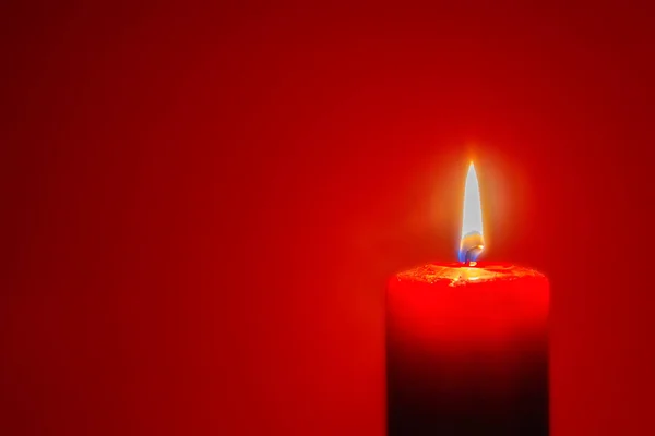 Red Candle Burning Dark Red Background Candlelight — Stock Photo, Image