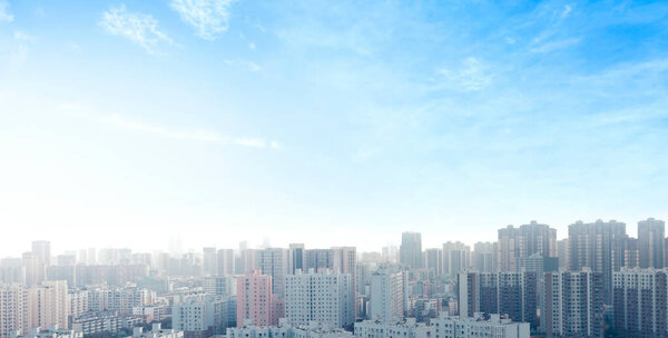 World Cities Day concept: real estate modern city urban skyline under blue sky