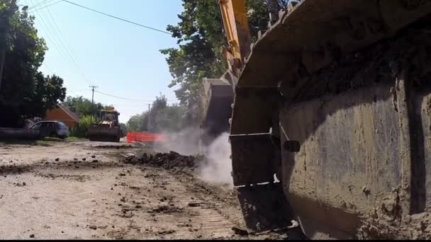 Large Tracked Excavator Digging at Construction Site — Stock Video