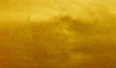 Altın cilalı metal desen soyut arkaplan.