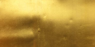 Altın cilalı metal desen soyut arkaplan.