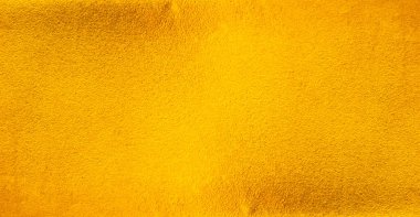 Altın metal fırçalanmış arka plan veya fırçalanmış çelik dokusu