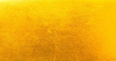Altın metal fırçalanmış arka plan veya fırçalanmış çelik dokusu