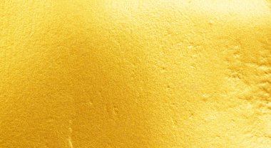 Altın metal fırçalanmış arka plan veya fırçalanmış çelik dokusu